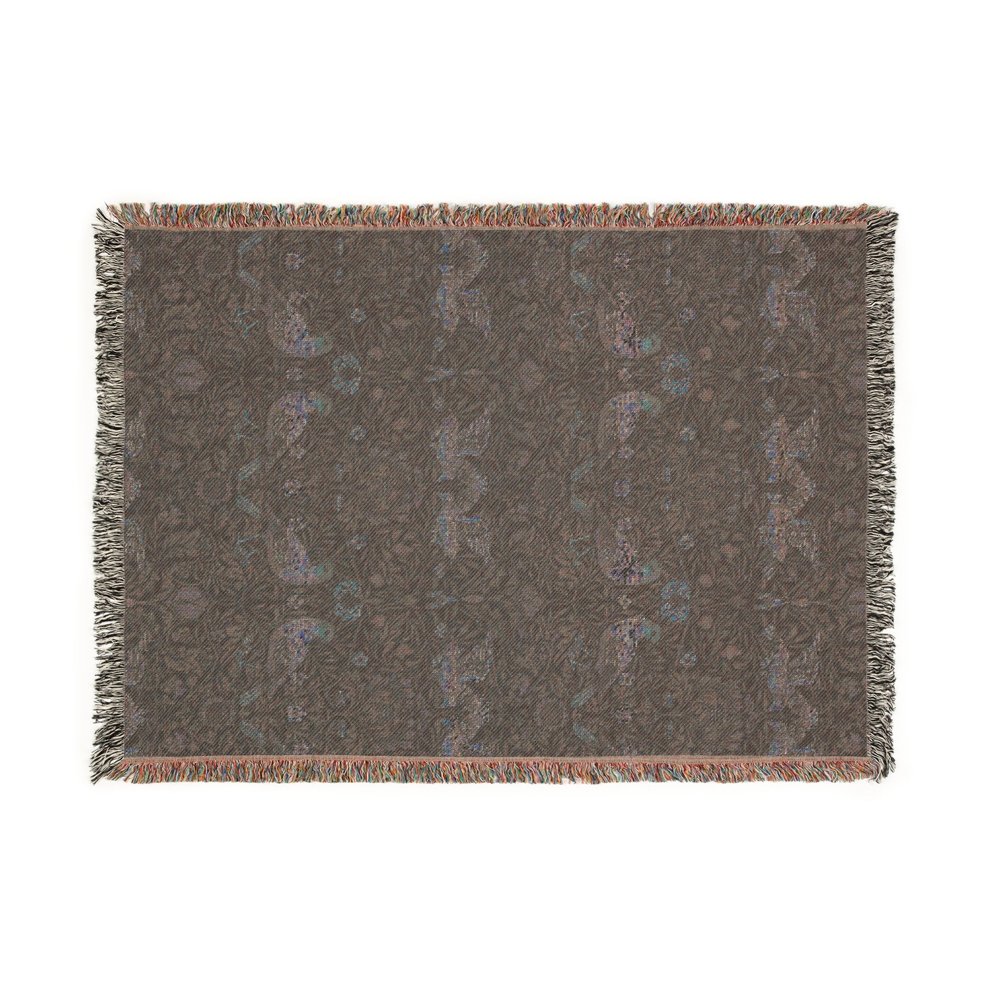 A woven cotton blanket with a geometric William Morris & Co pattern in shades of blue and a fringed edge.