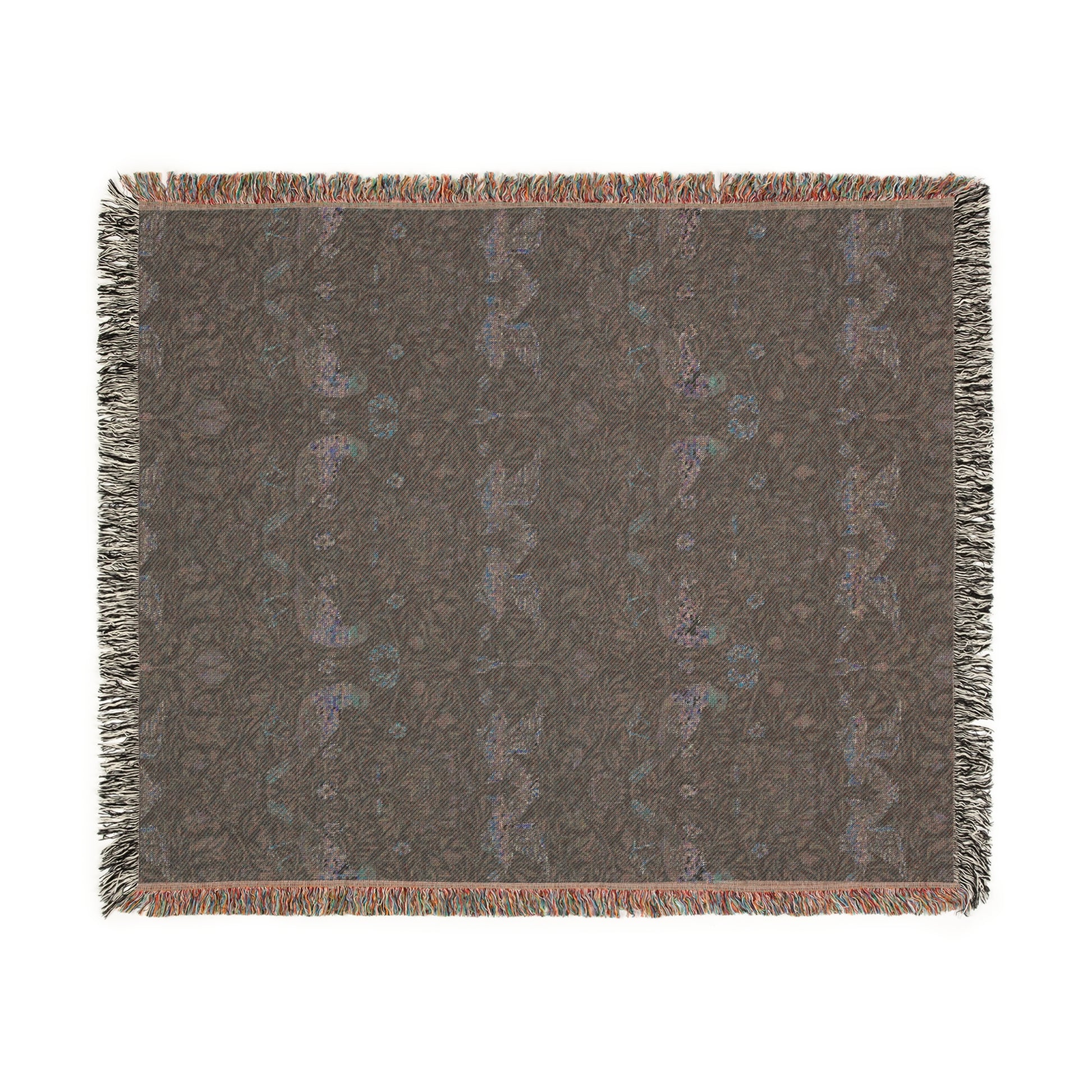 A woven cotton blanket with a geometric William Morris & Co pattern in shades of blue and a fringed edge.