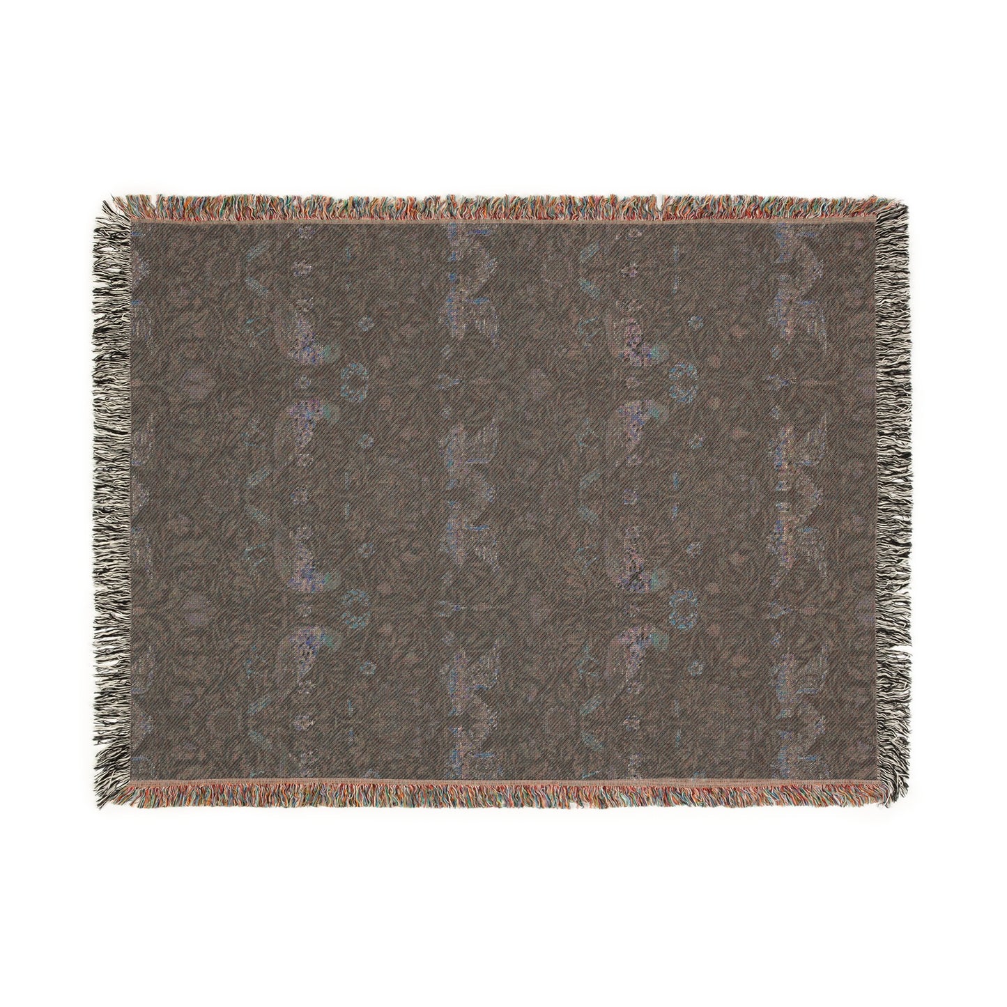 A woven cotton blanket with a geometric William Morris & Co pattern in shades of blue and a fringed edge.