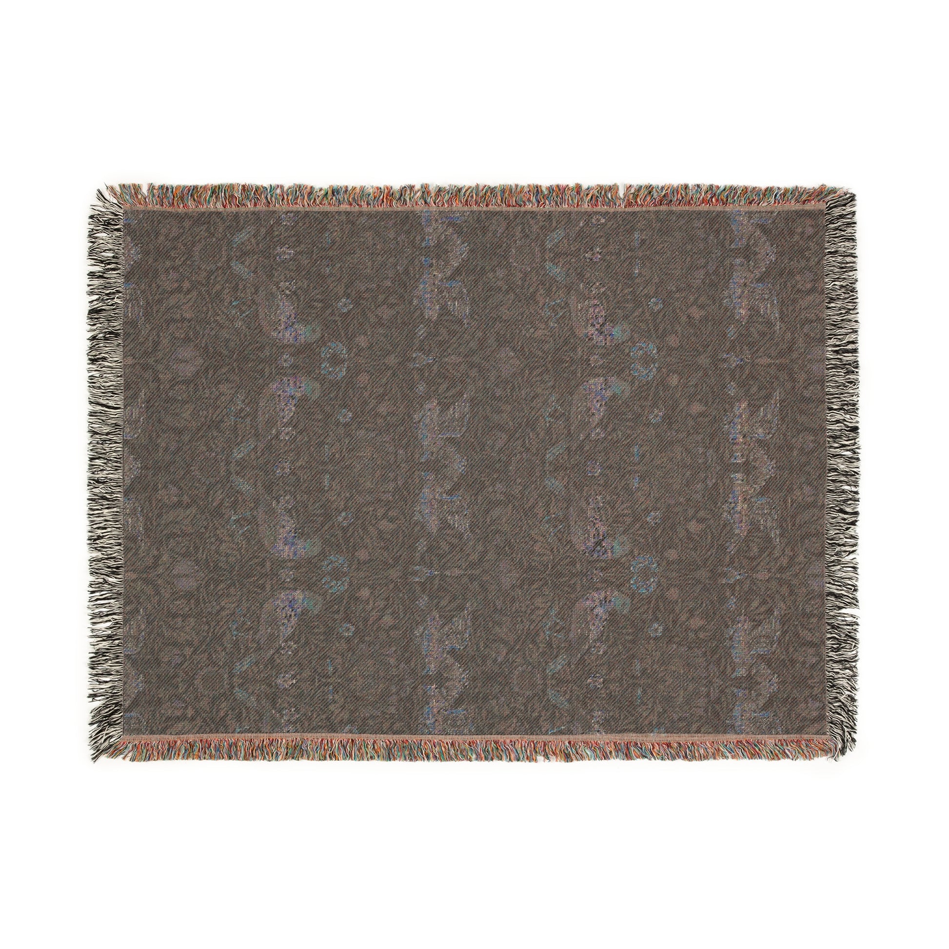 A woven cotton blanket with a geometric William Morris & Co pattern in shades of blue and a fringed edge.