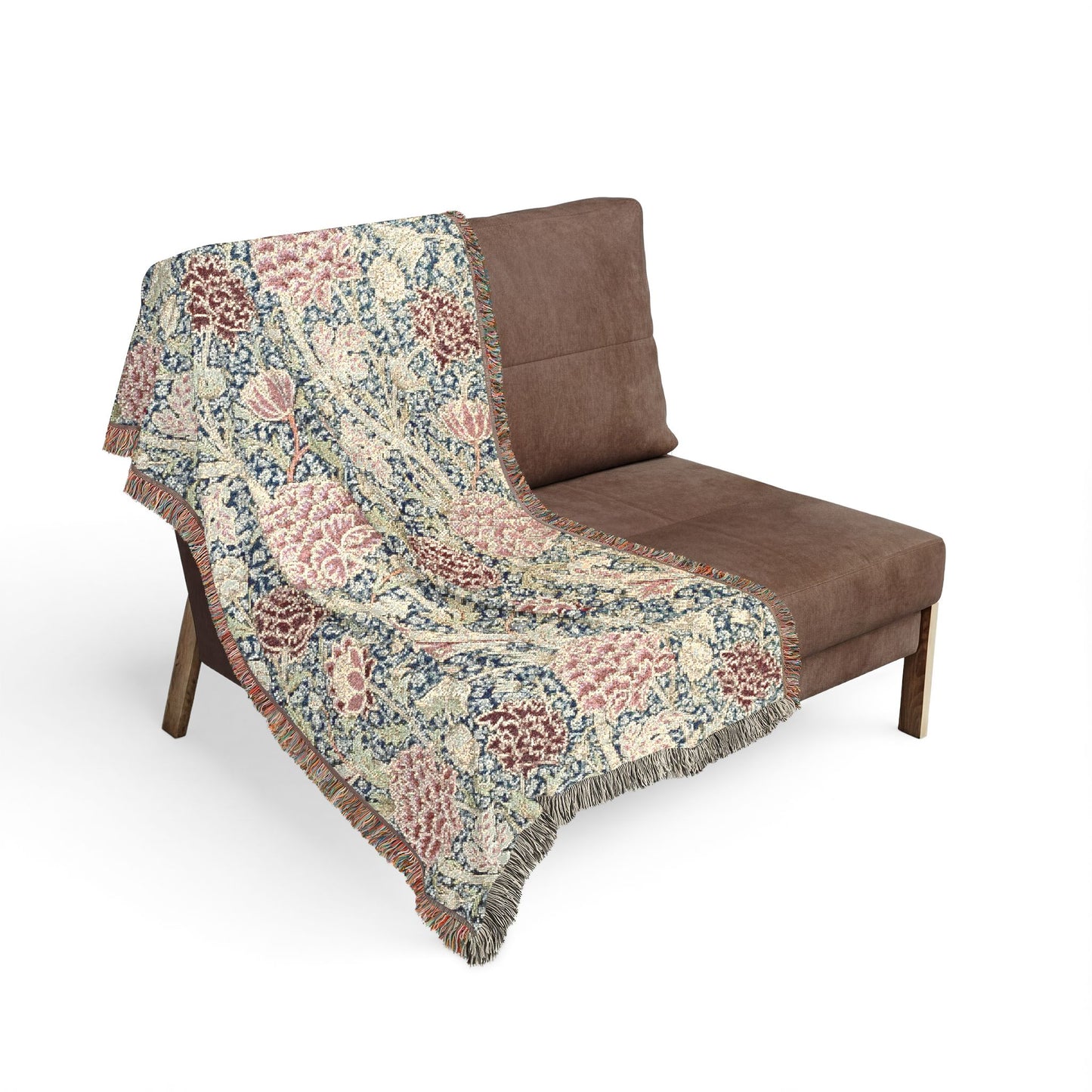 Floral patterned throw blanket draped over a brown chair on a white background