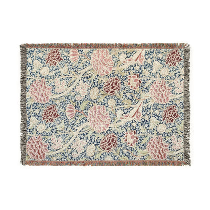 Floral patterned throw blanket with pink and blue flowers on a beige background