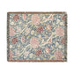 Floral patterned throw blanket with fringe on a white background