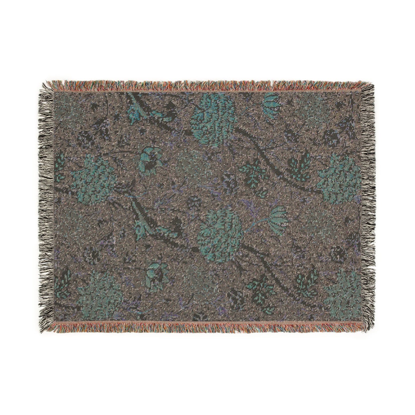 Floral patterned throw blanket with fringe on a white background