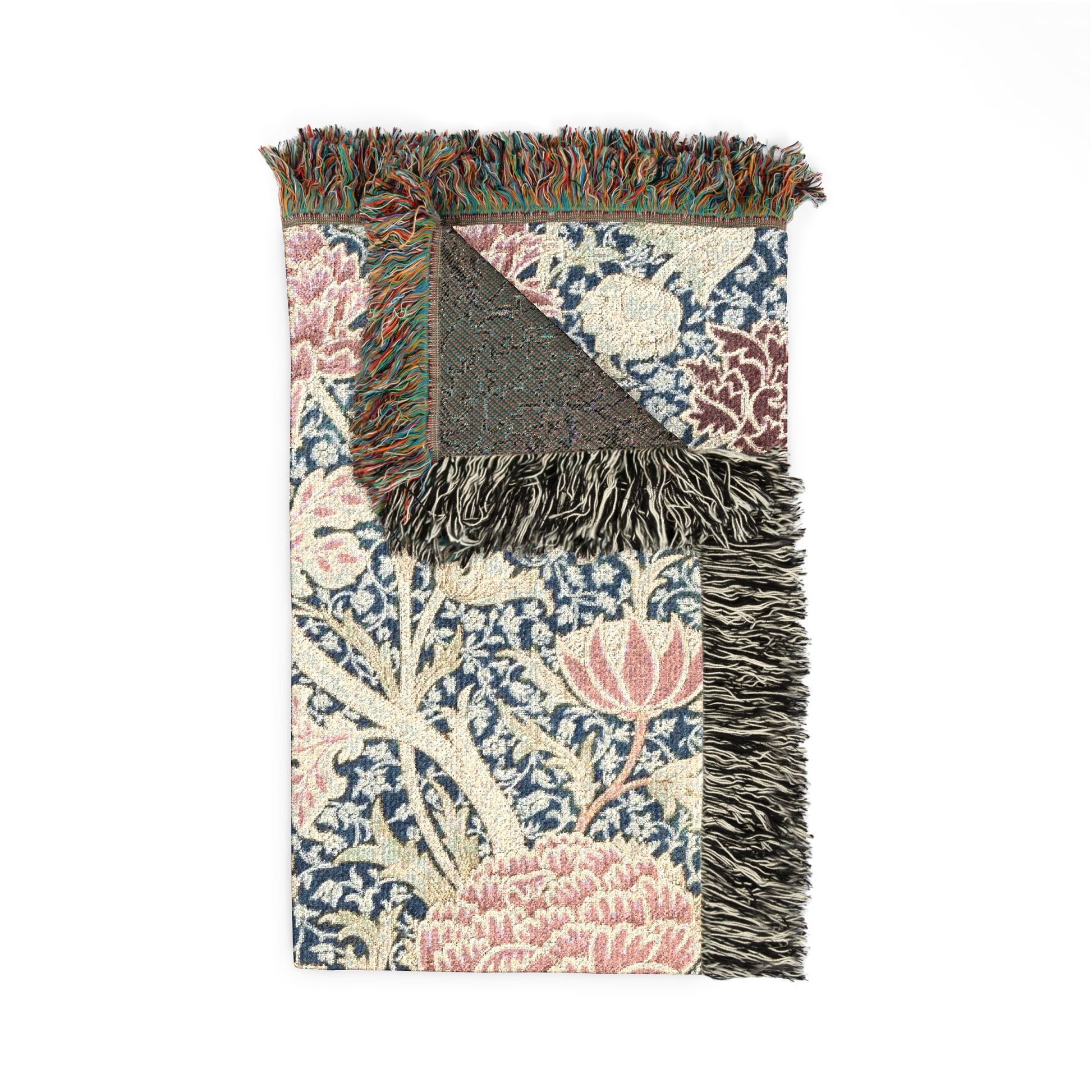 Floral patterned rug with fringe on a white background