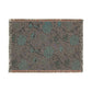 Floral patterned rug with fringe on a white background