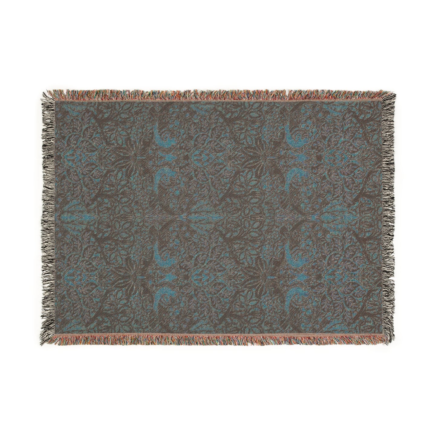 A woven cotton blanket with a floral William Morris & Co pattern in shades of brown, beige, and green, featuring colourful fringed edges.