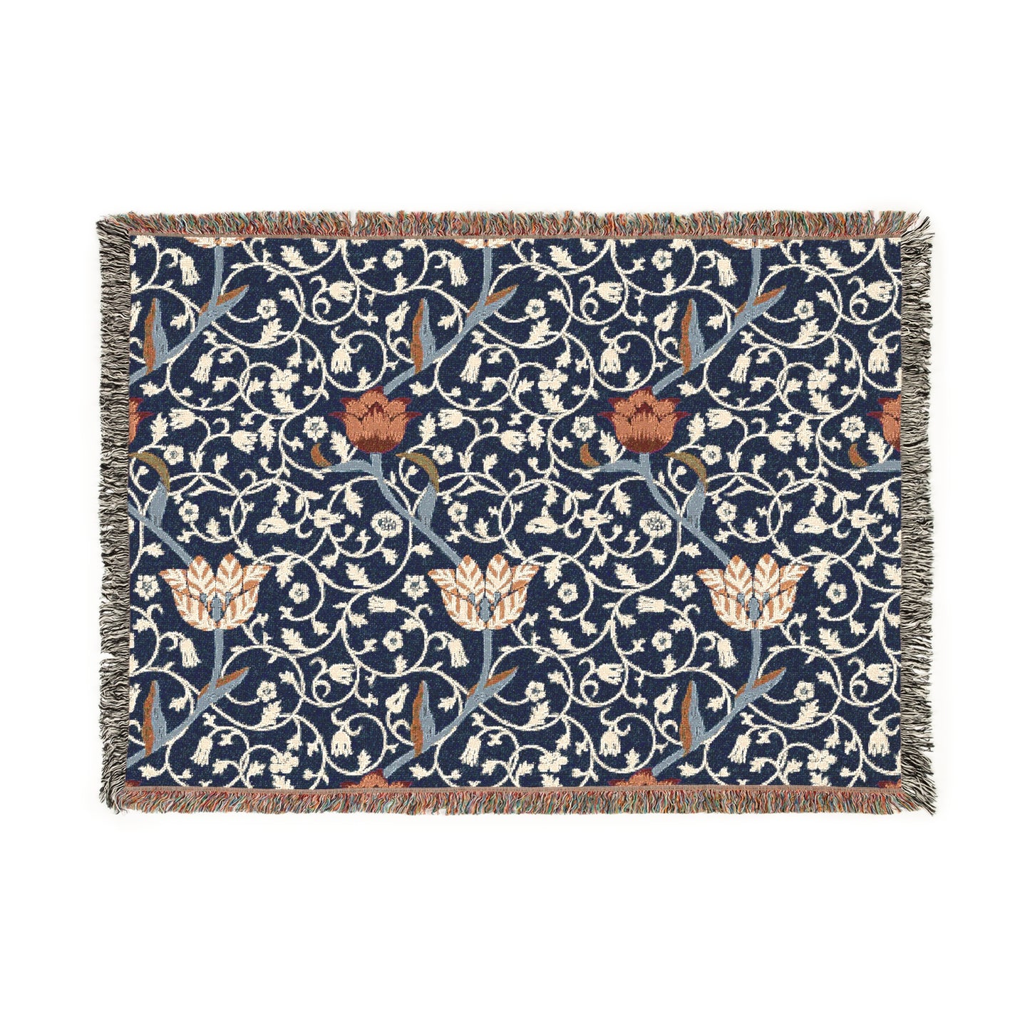 A woven cotton blanket with a geometric William Morris & Co pattern in blue, red and white colours, featuring fringed edges.