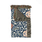 Decorative throw blanket with floral pattern and fringe on a white background