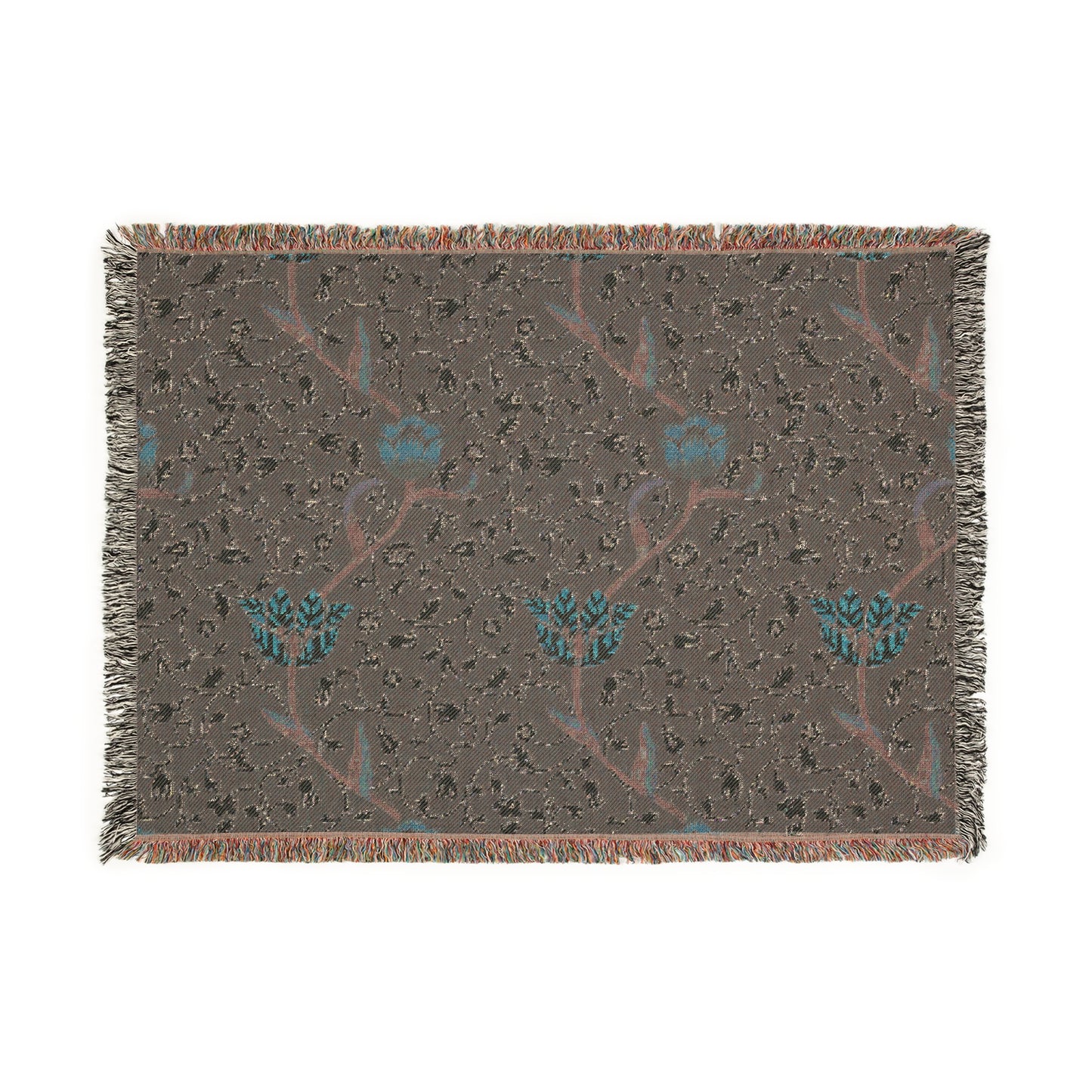 A woven cotton blanket with a geometric William Morris & Co pattern in blue, red and white colours, featuring fringed edges.