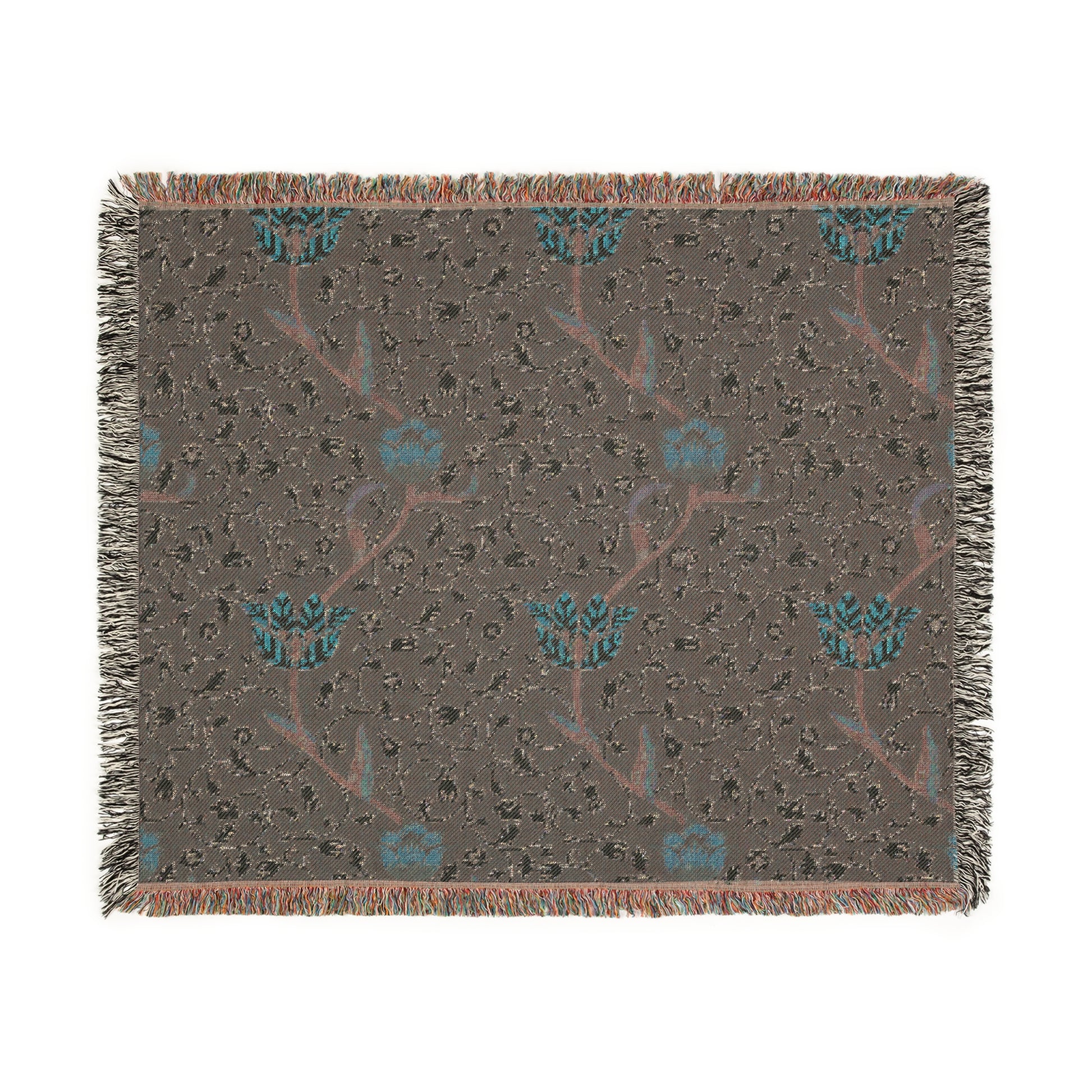 A woven cotton blanket with a geometric William Morris & Co pattern in blue, red and white colours, featuring fringed edges.