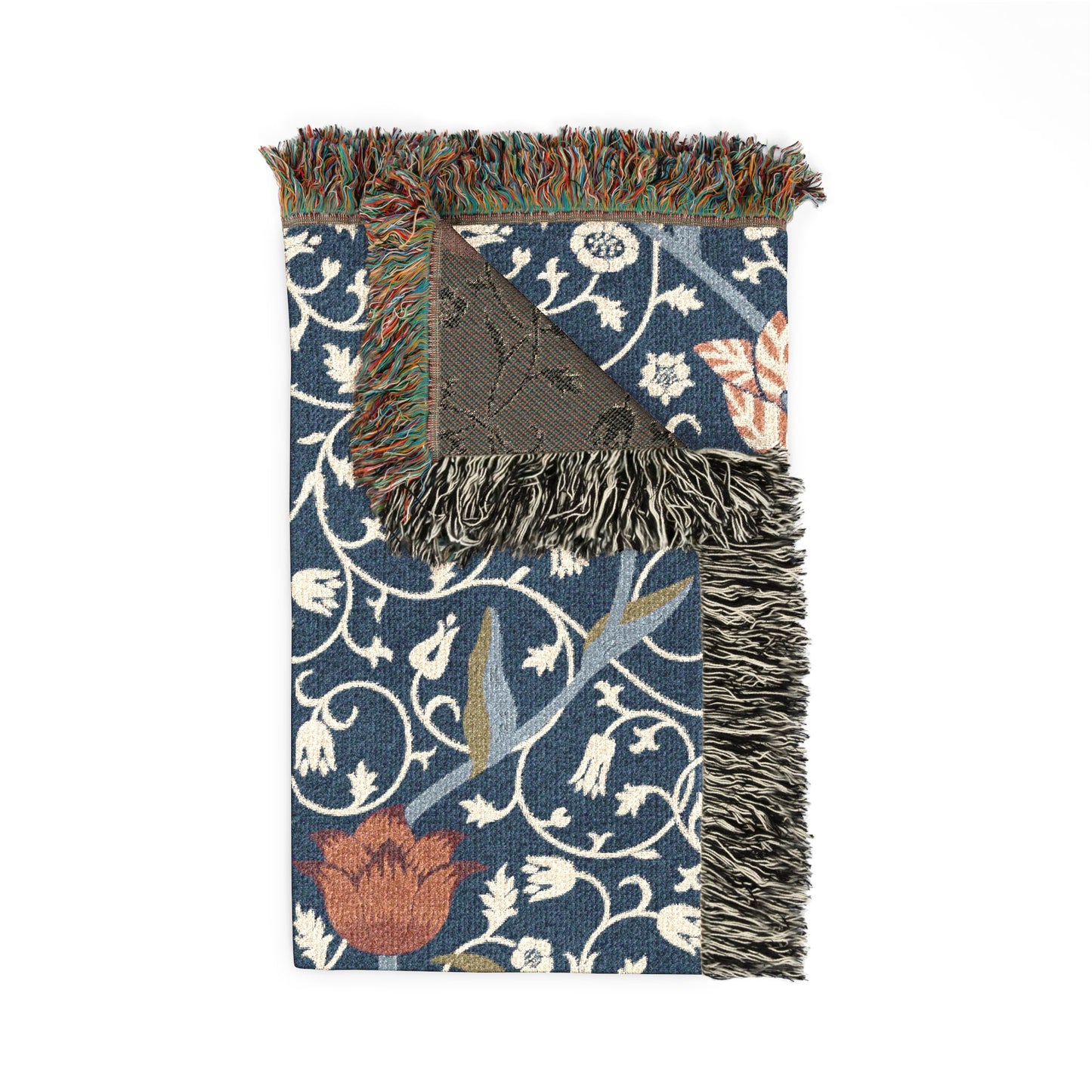Decorative throw blanket with floral pattern and fringe on a white background