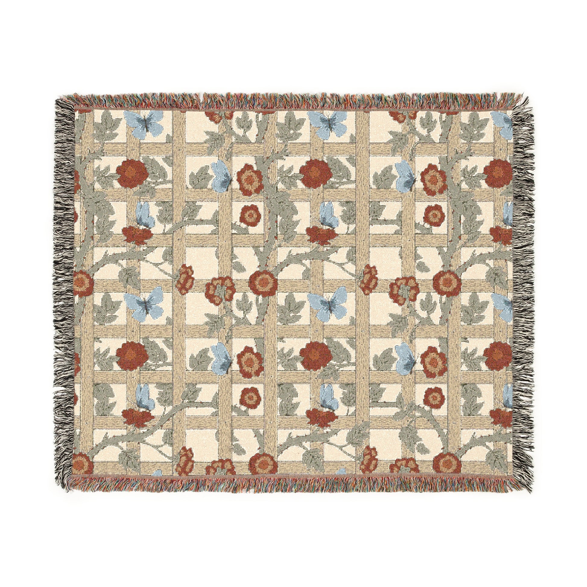 A woven cotton blanket with a geometric pattern featuring floral motifs and a colorful edge fringe.