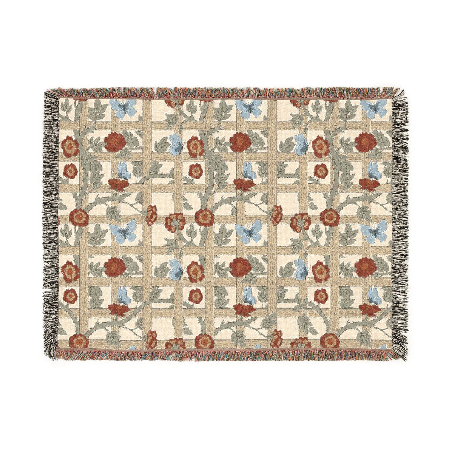 A woven cotton blanket with a geometric pattern featuring floral motifs and a colorful edge fringe.