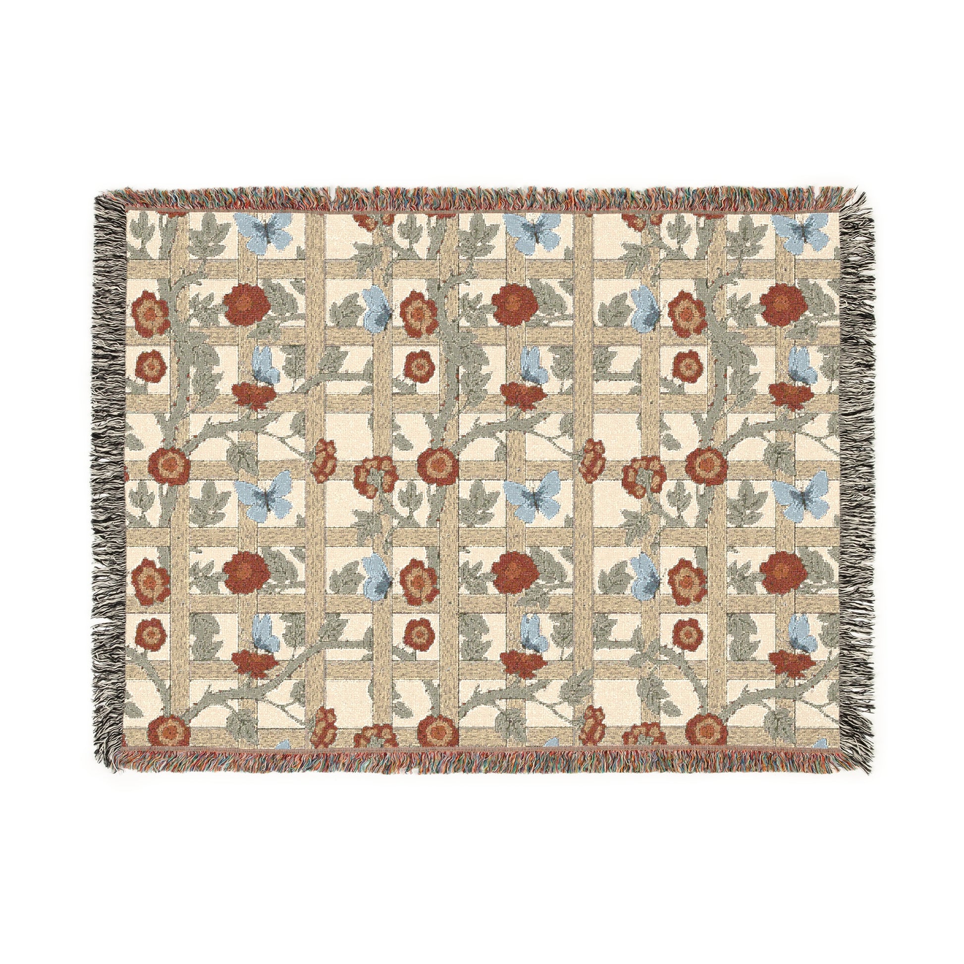 A woven cotton blanket with a geometric pattern featuring floral motifs and a colorful edge fringe.