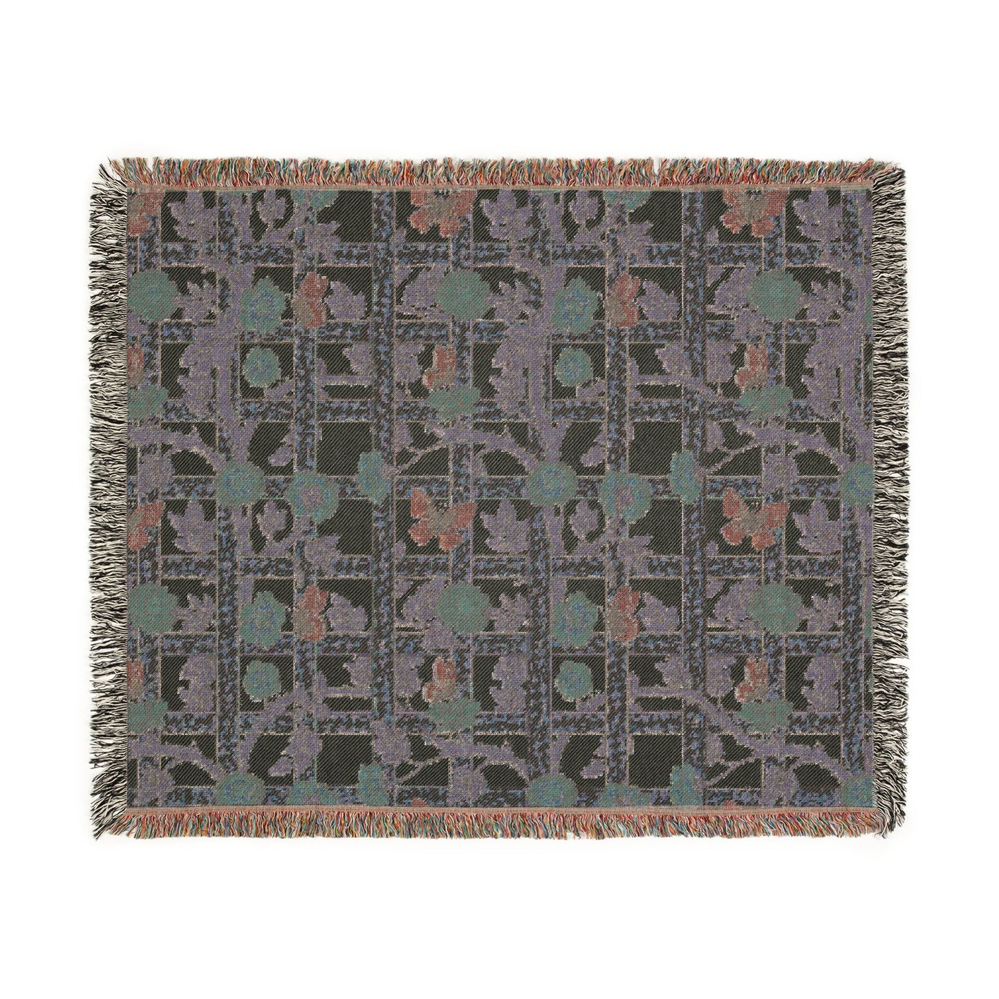 A woven cotton blanket with a William Morris & Co geometric pattern featuring floral motifs and a colourful edge fringe.