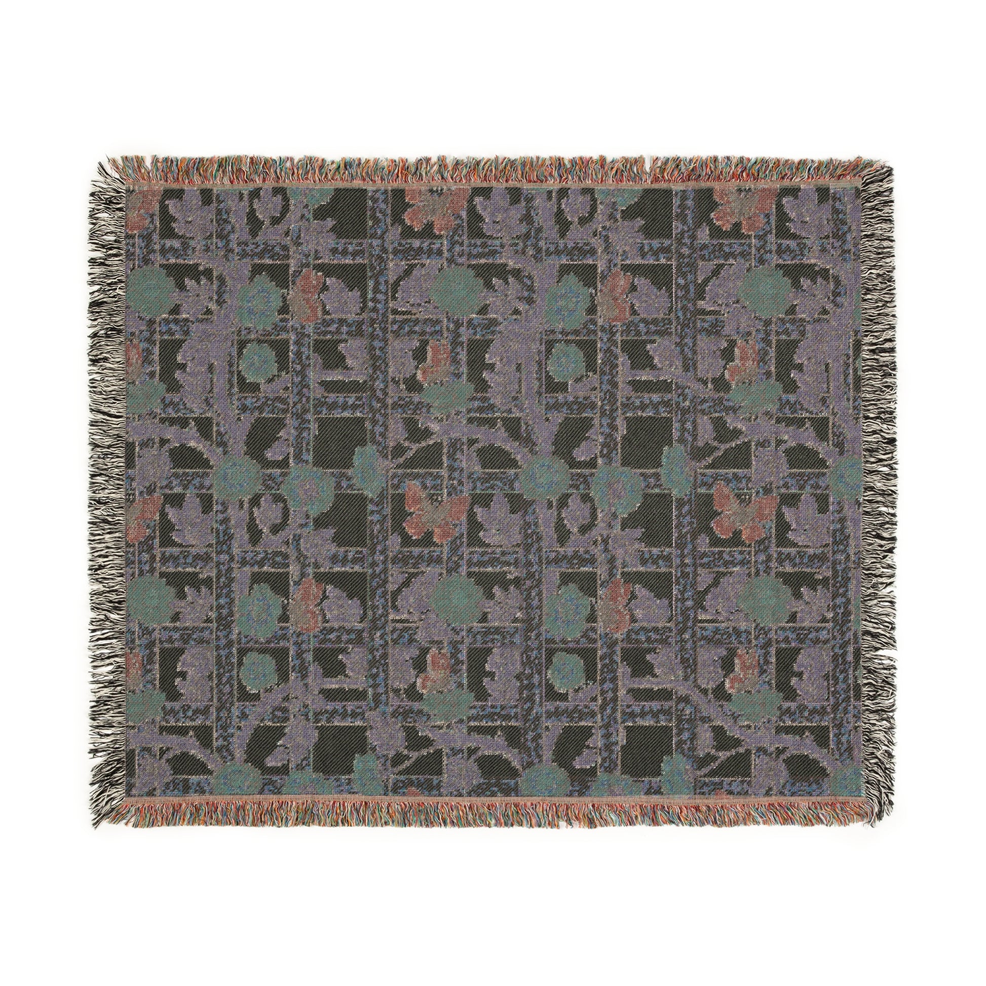 A woven cotton blanket with a William Morris & Co geometric pattern featuring floral motifs and a colourful edge fringe.