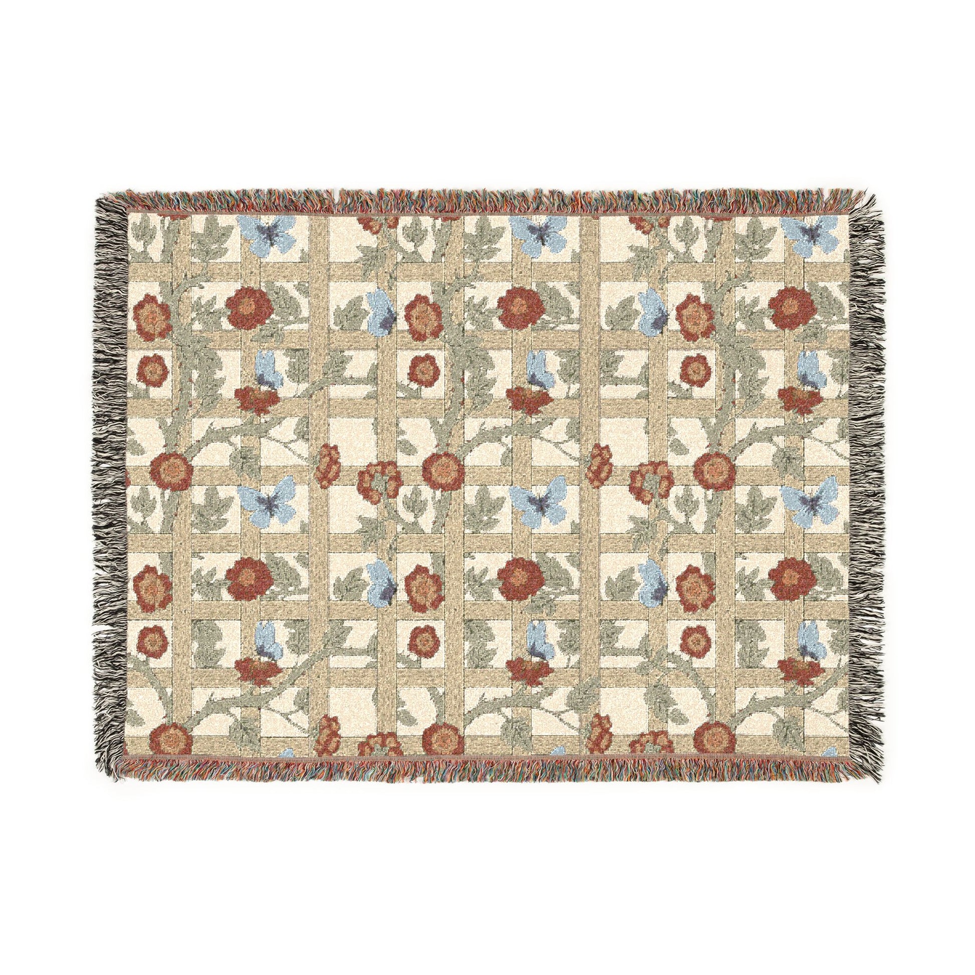 Woven blanket with floral and butterfly pattern on a white background