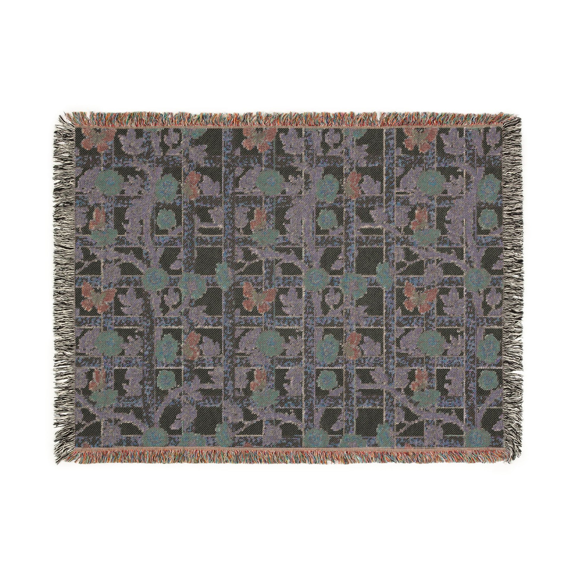 Patterned throw blanket with fringe on a white background