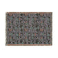 Patterned throw blanket with geometric design on a white background