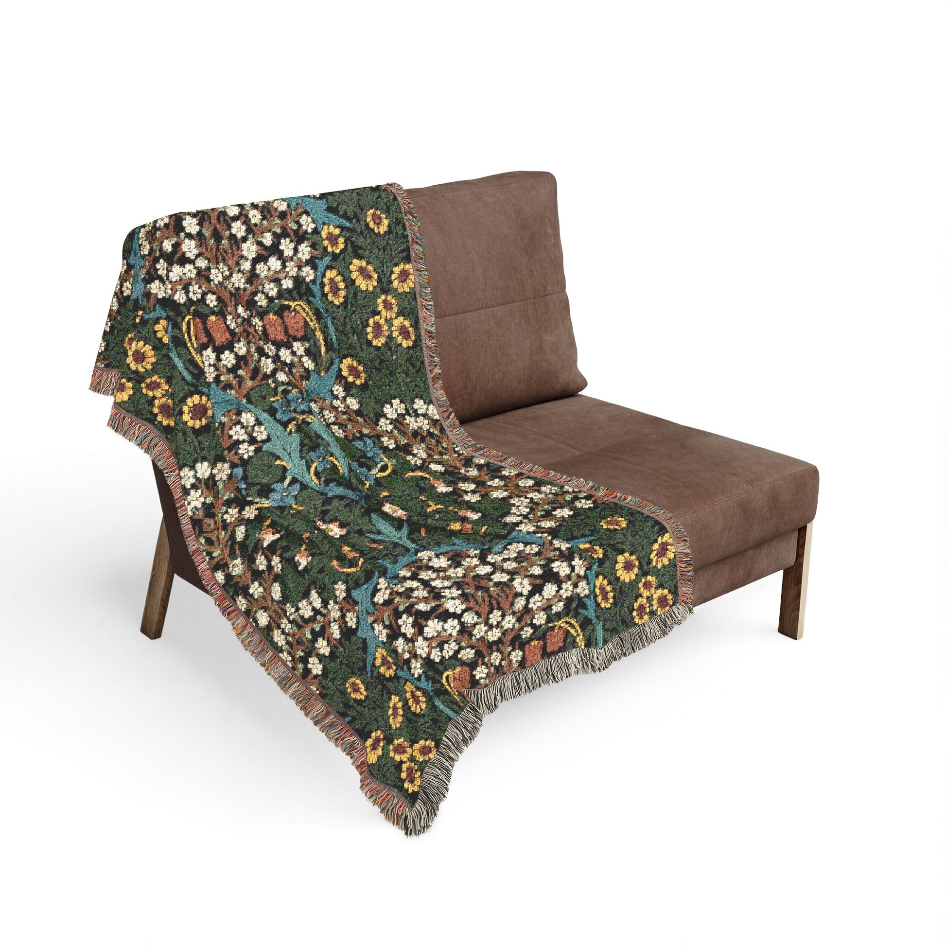 Floral-patterned blanket draped over a brown chair on a white background