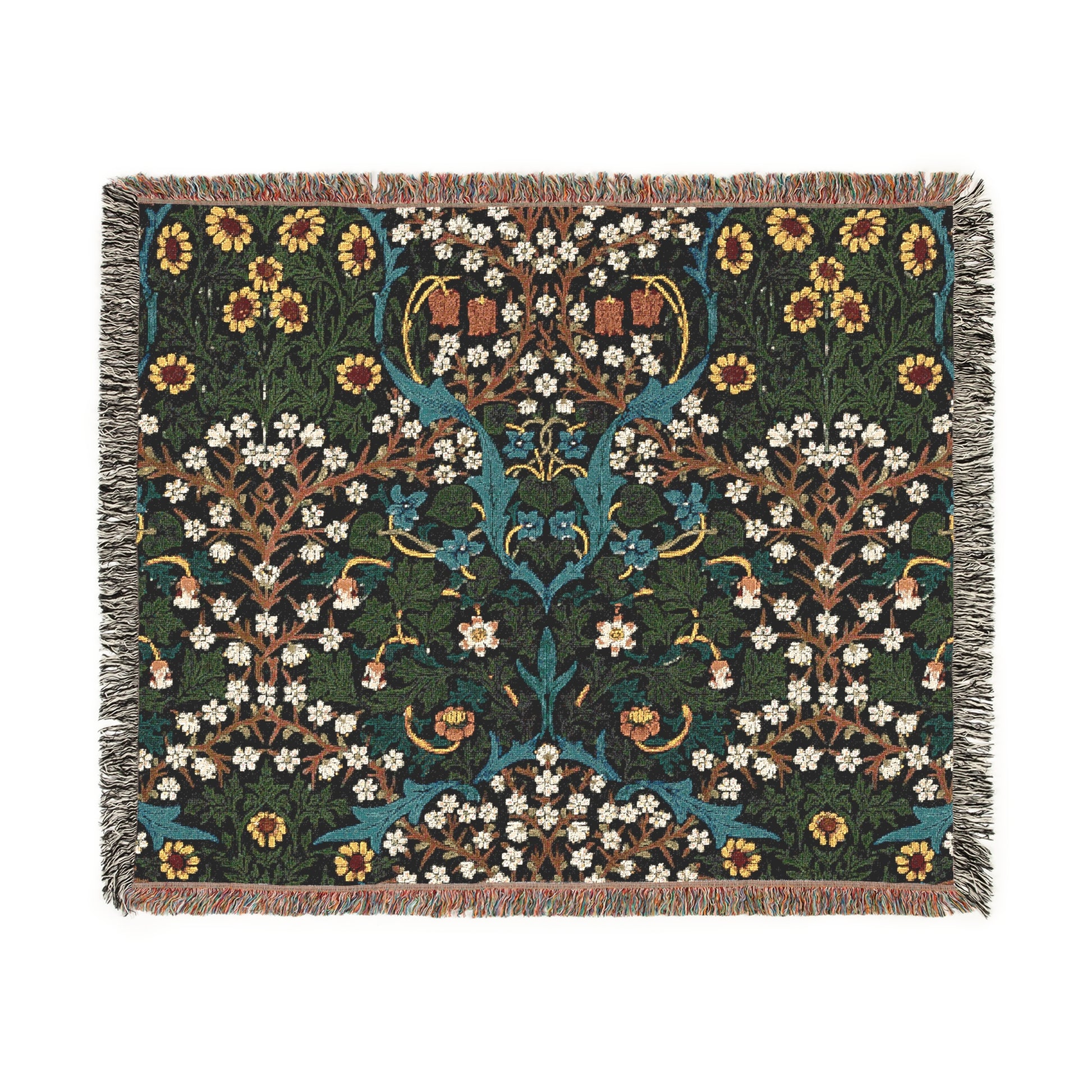 A woven cotton blanket with a floral pattern in multiple colors, including green, blue, and red, with fringed edges.