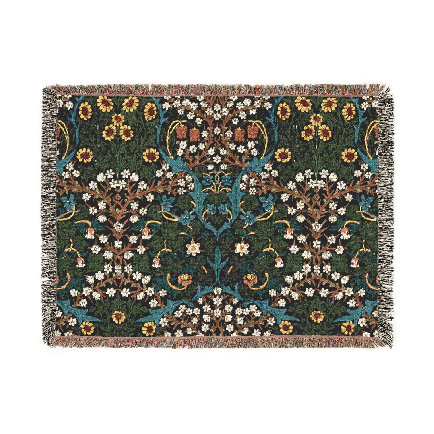 A woven cotton blanket with a floral pattern in multiple colors, including green, blue, and red, with fringed edges.