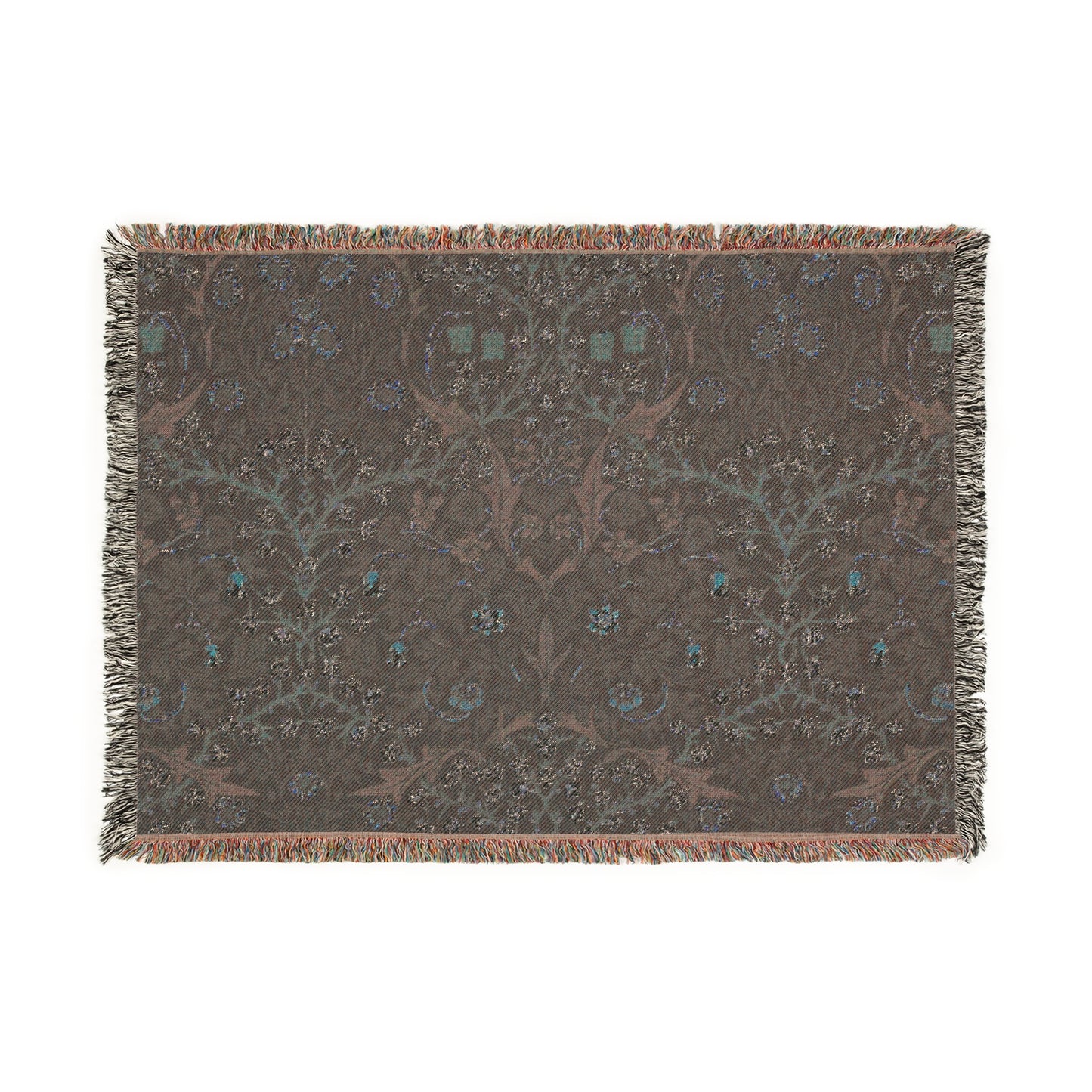 A woven cotton blanket with a floral William Morris & Co pattern in multiple colours, including green, blue, and red, with fringed edges.