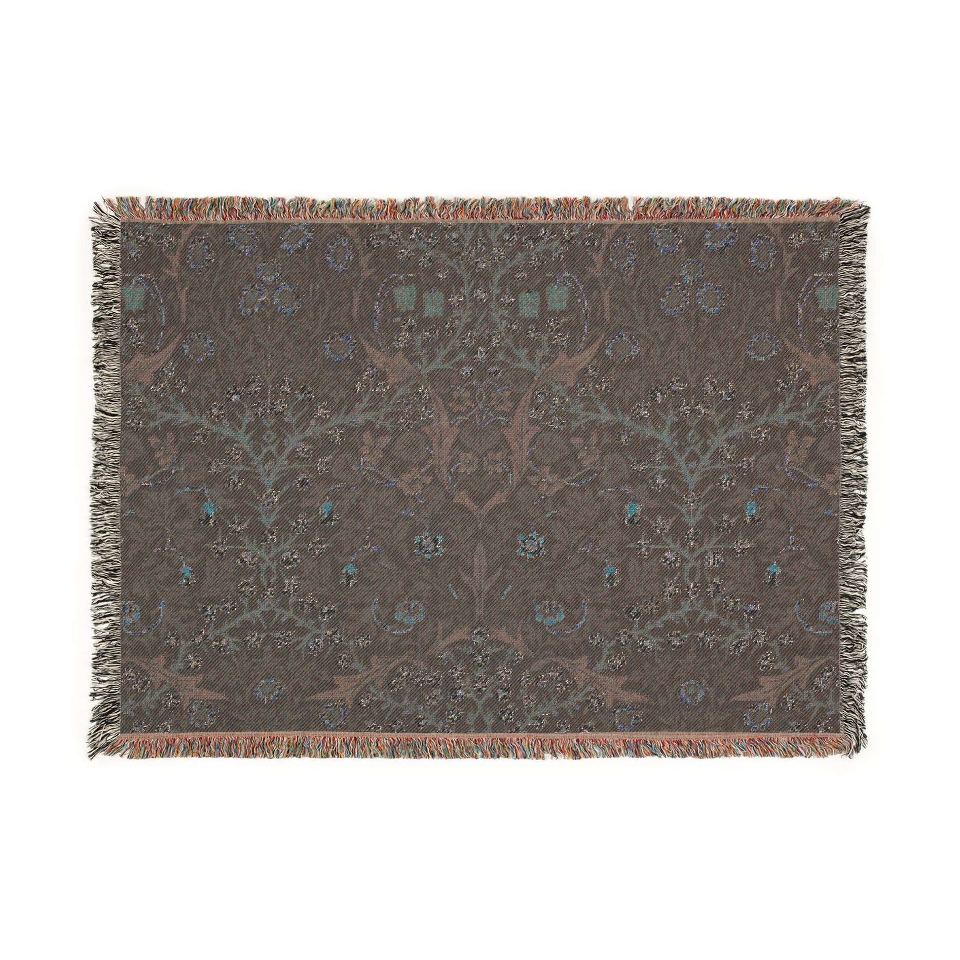 A woven cotton blanket with a floral William Morris & Co pattern in multiple colours, including green, blue, and red, with fringed edges.