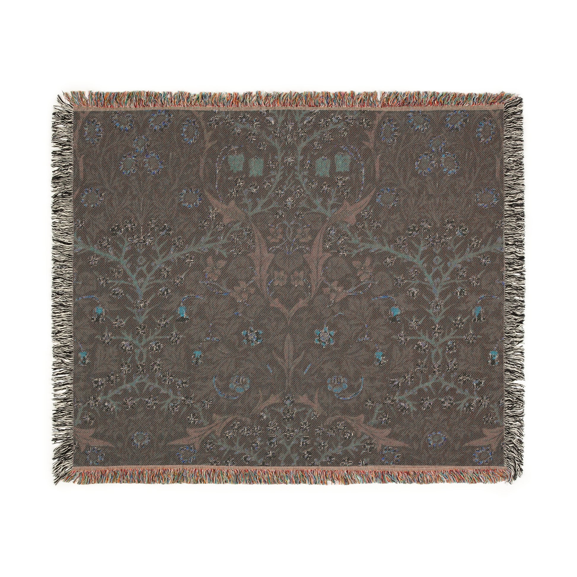 A woven cotton blanket with a floral William Morris & Co pattern in multiple colours, including green, blue, and red, with fringed edges.