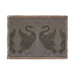 Woven blanket with swan design on a plain background