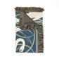 Decorative rug with swan design and fringe details on a white background