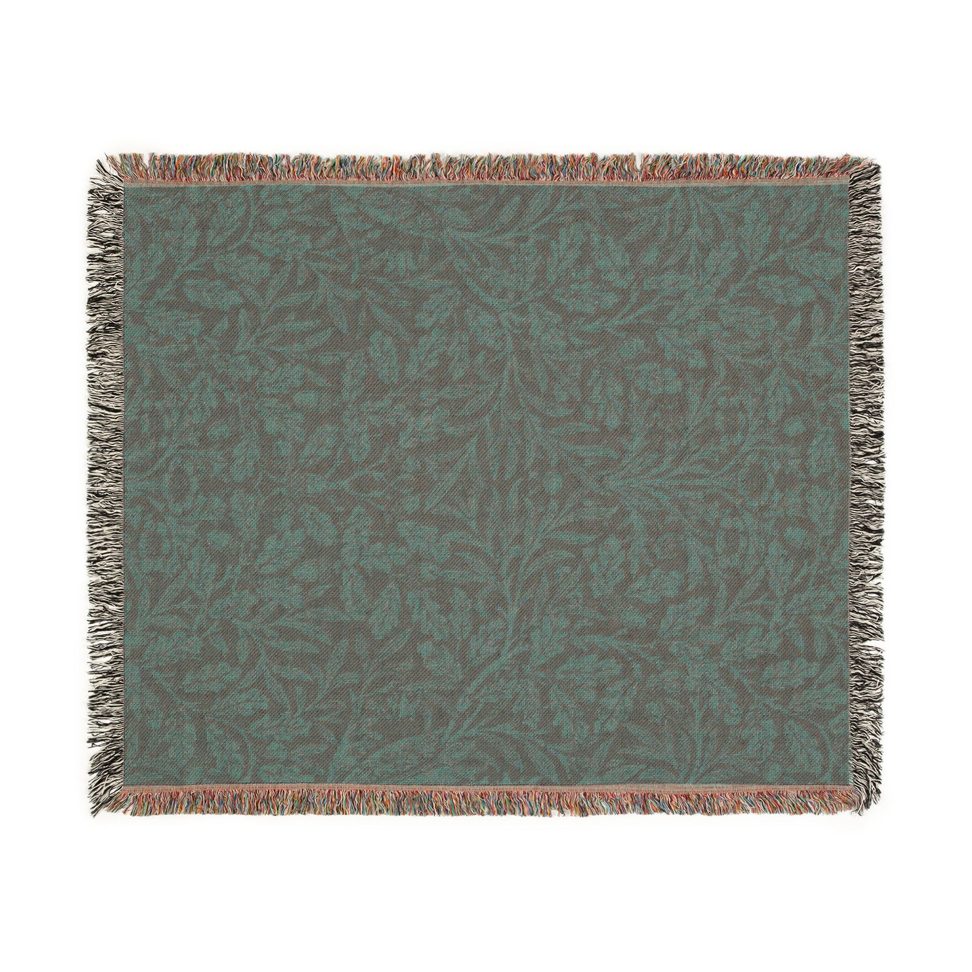 Textured green blanket with leaf pattern on a white background
