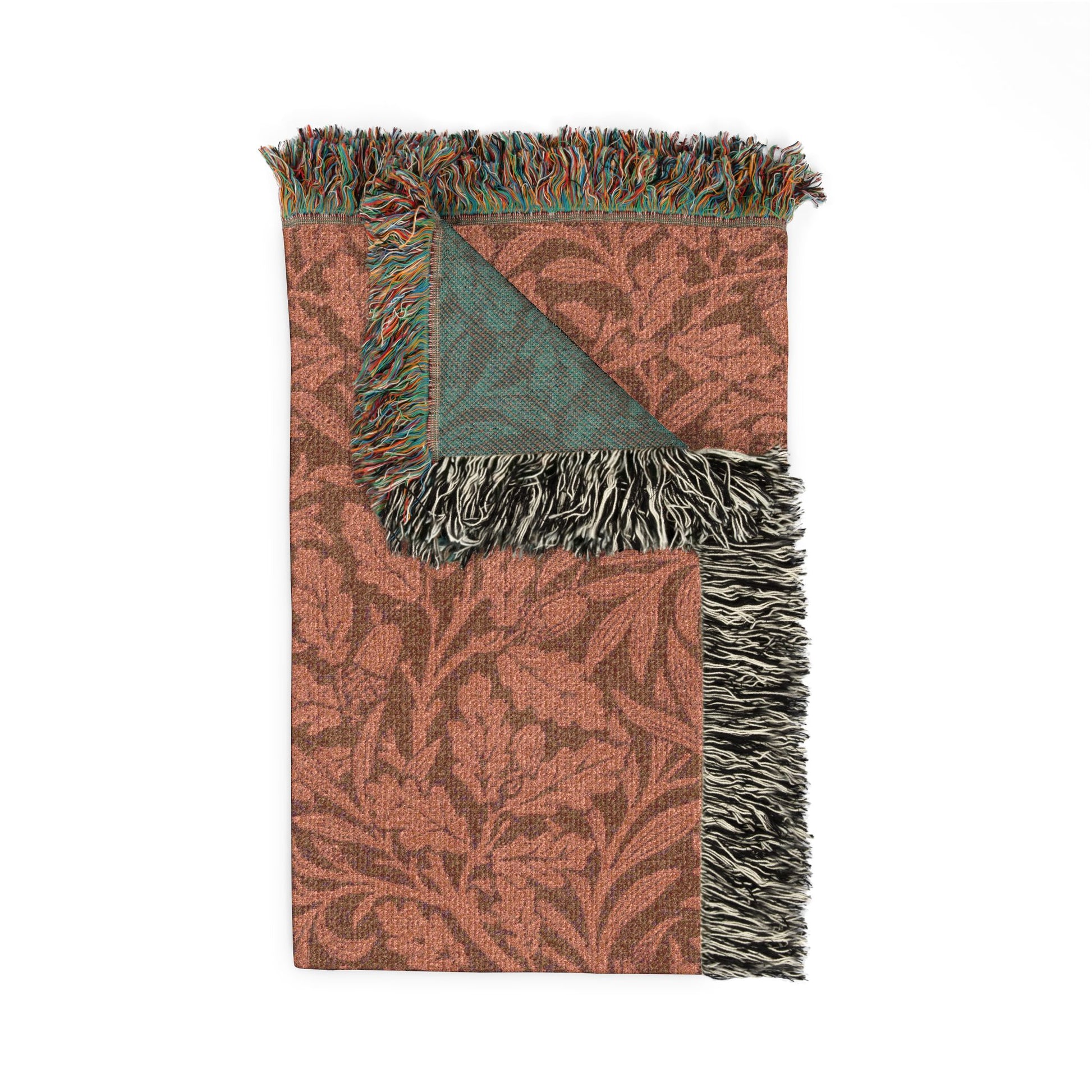 Patterned throw blanket with fringes on a white background