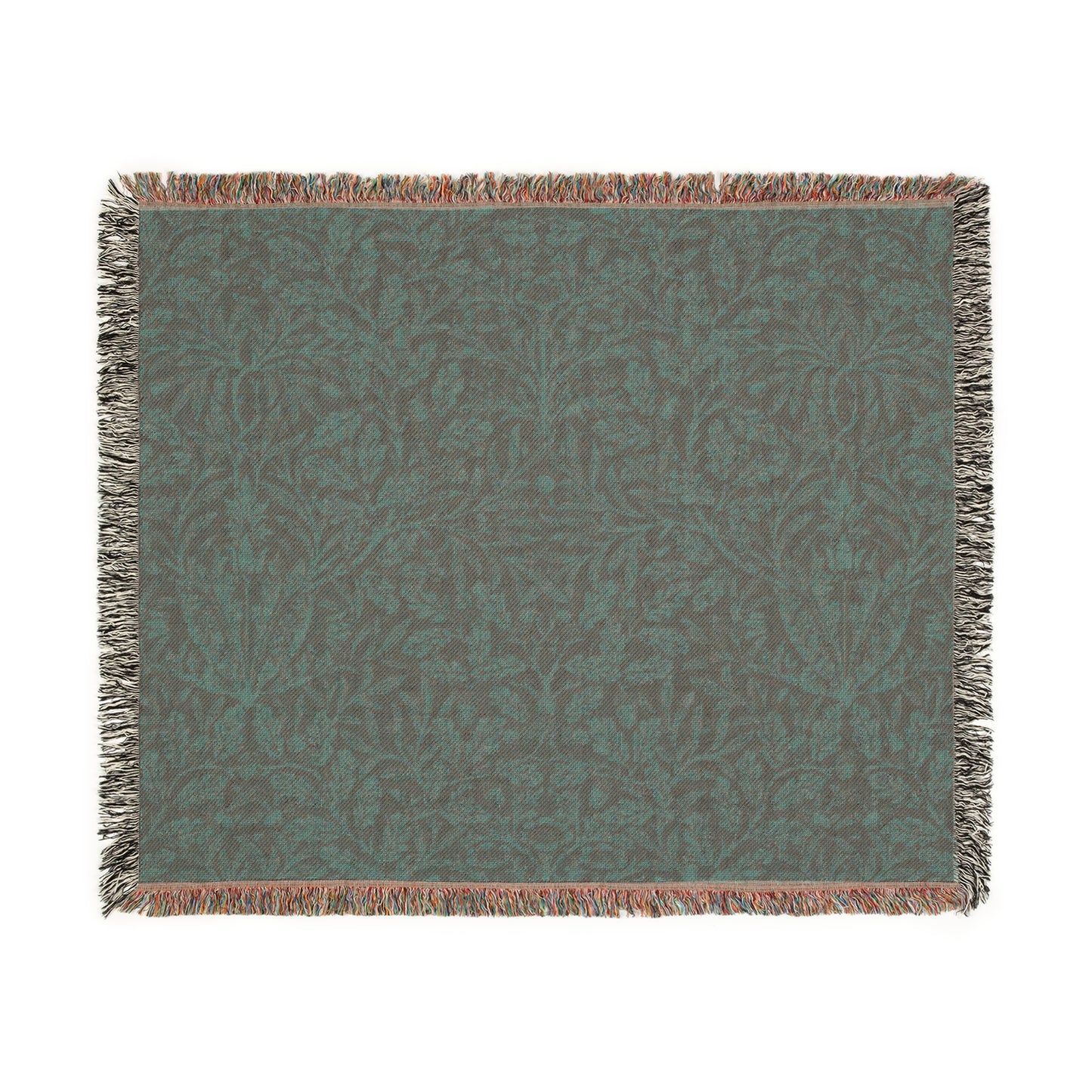 A woven cotton blanket with a floral William Morris & Co geometric pattern in a rust colour, featuring a colourful fringed edge.