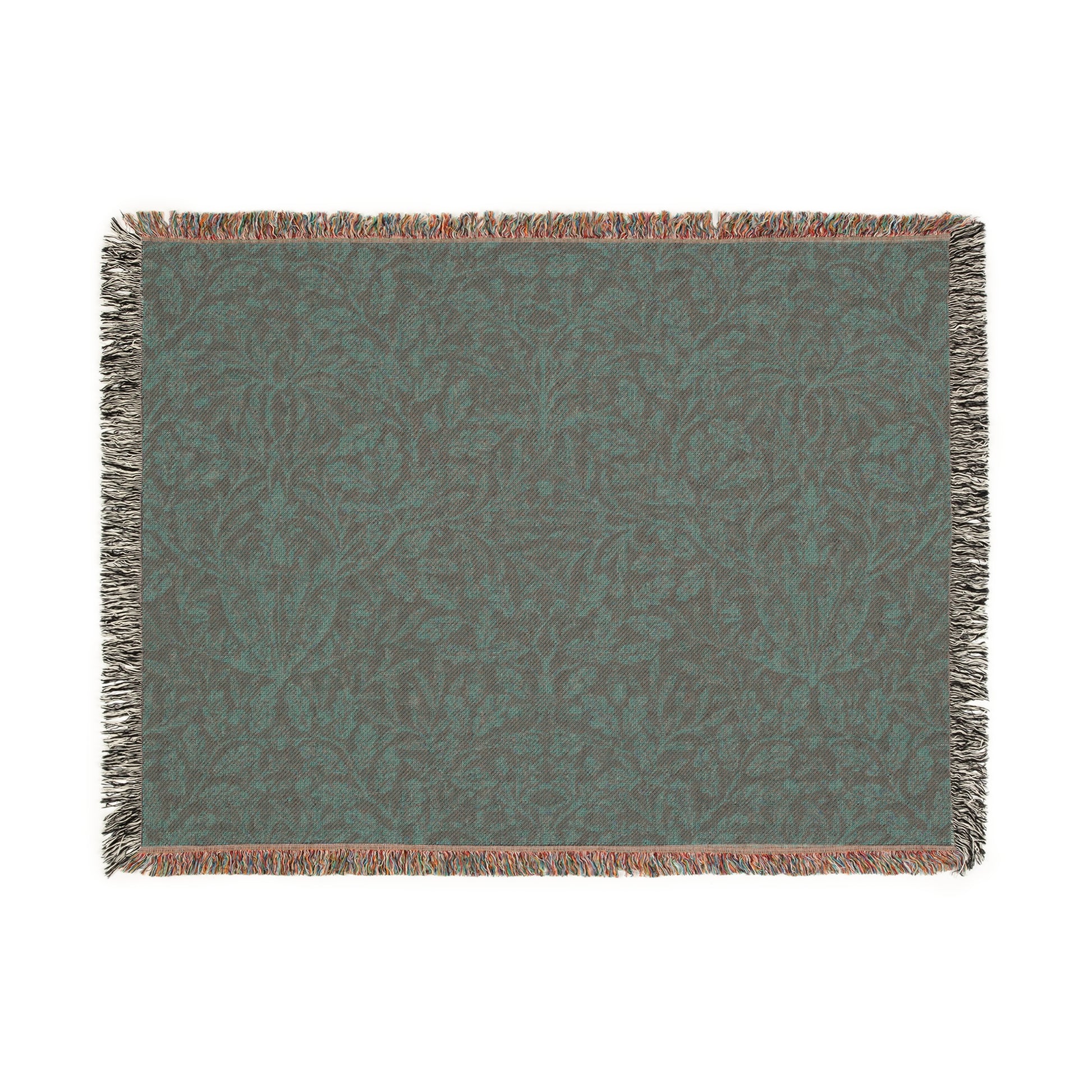 A woven cotton blanket with a floral William Morris & Co geometric pattern in a rust colour, featuring a colourful fringed edge.