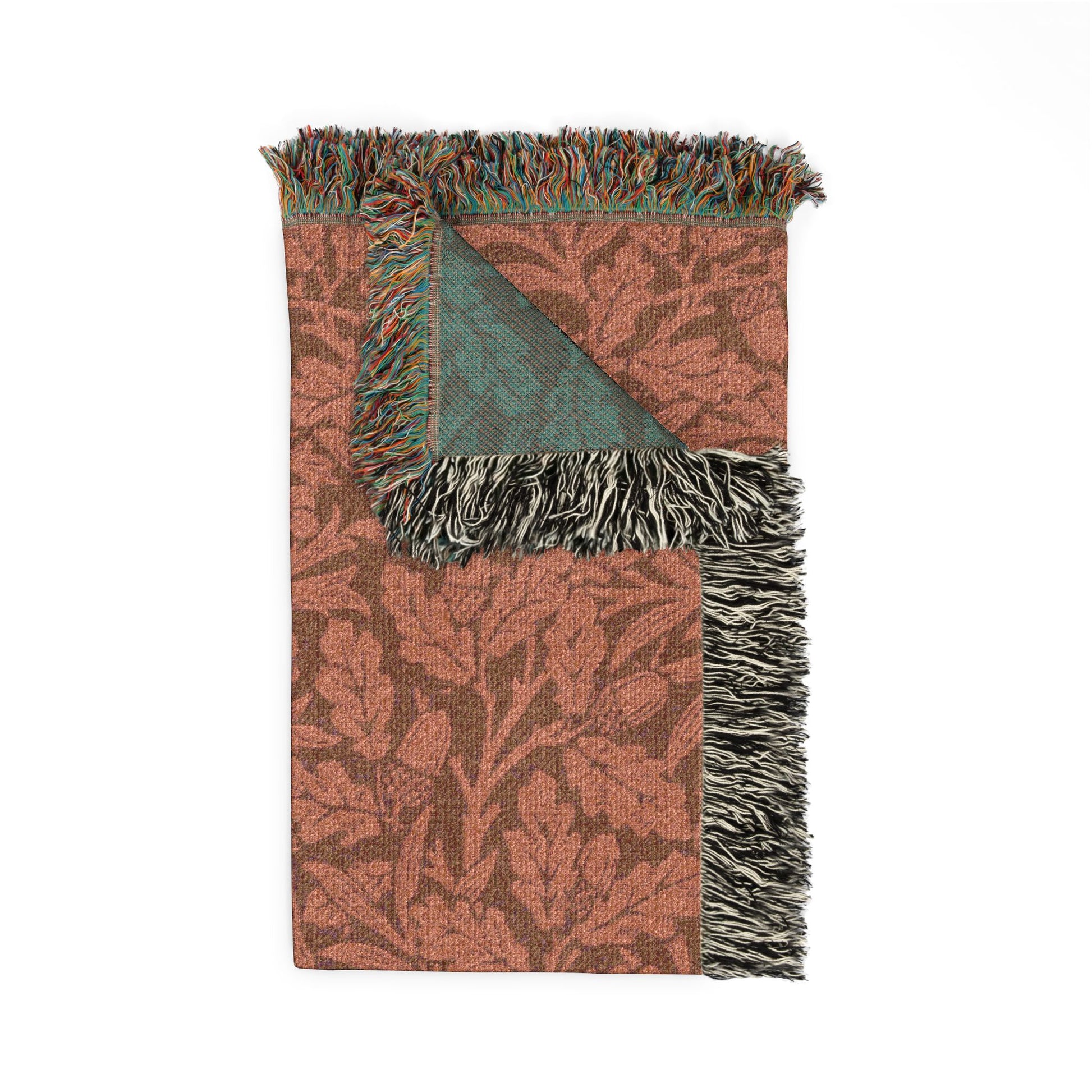 Patterned throw blanket with fringes on a white background