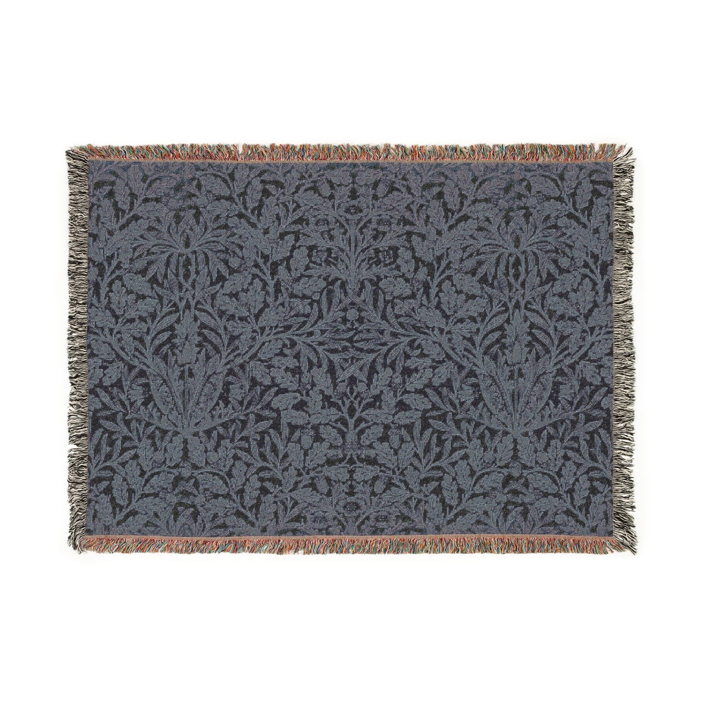 A woven cotton blanket with a geometric William Morris & Co pattern in smoky blue colour, featuring fringed edges.