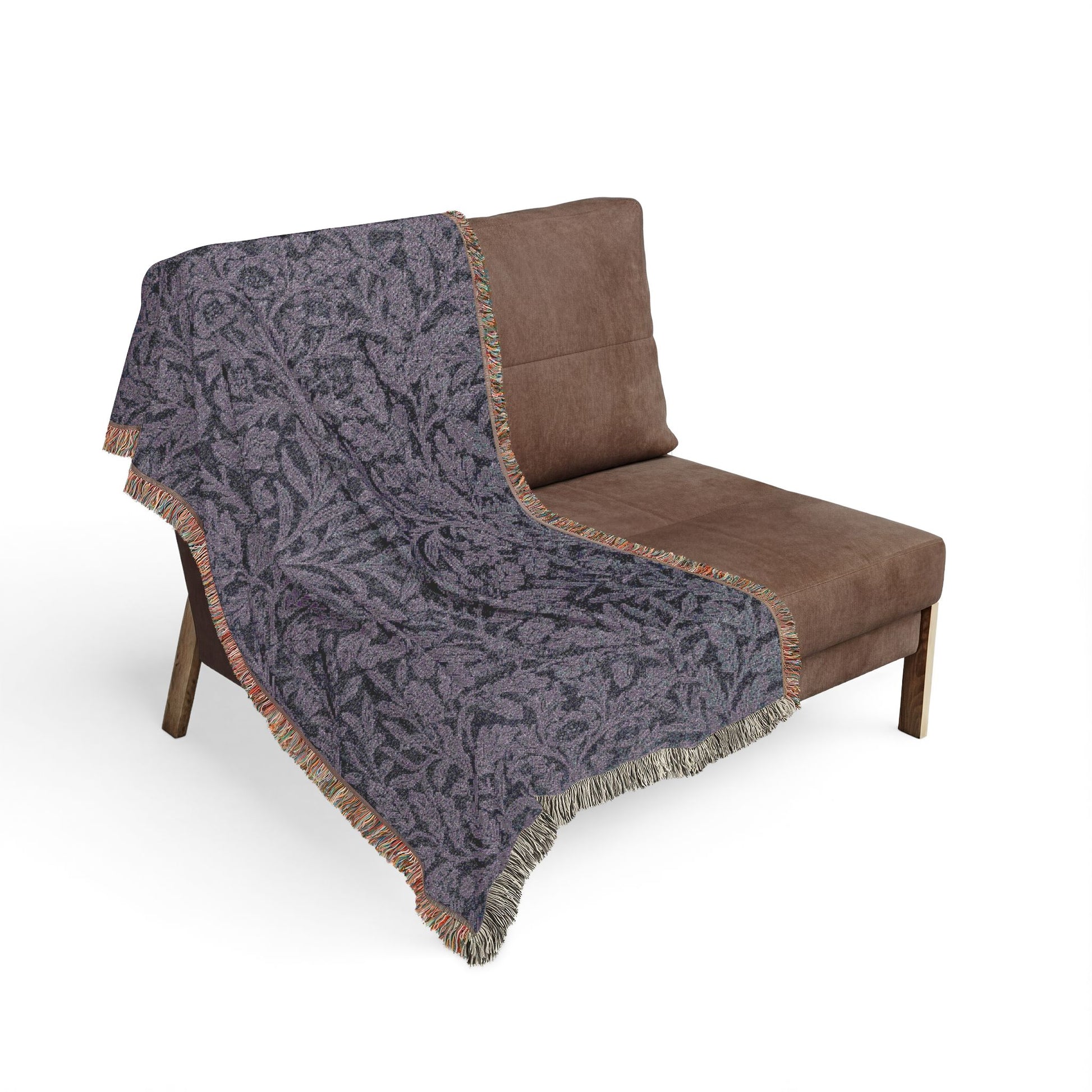 Brown chair with a patterned gray blanket draped over it on a white background