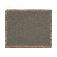 Green woven blanket with leaf pattern on a white background