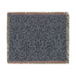 A woven cotton blanket with a geometric pattern in smoky blue color, featuring fringed edges.