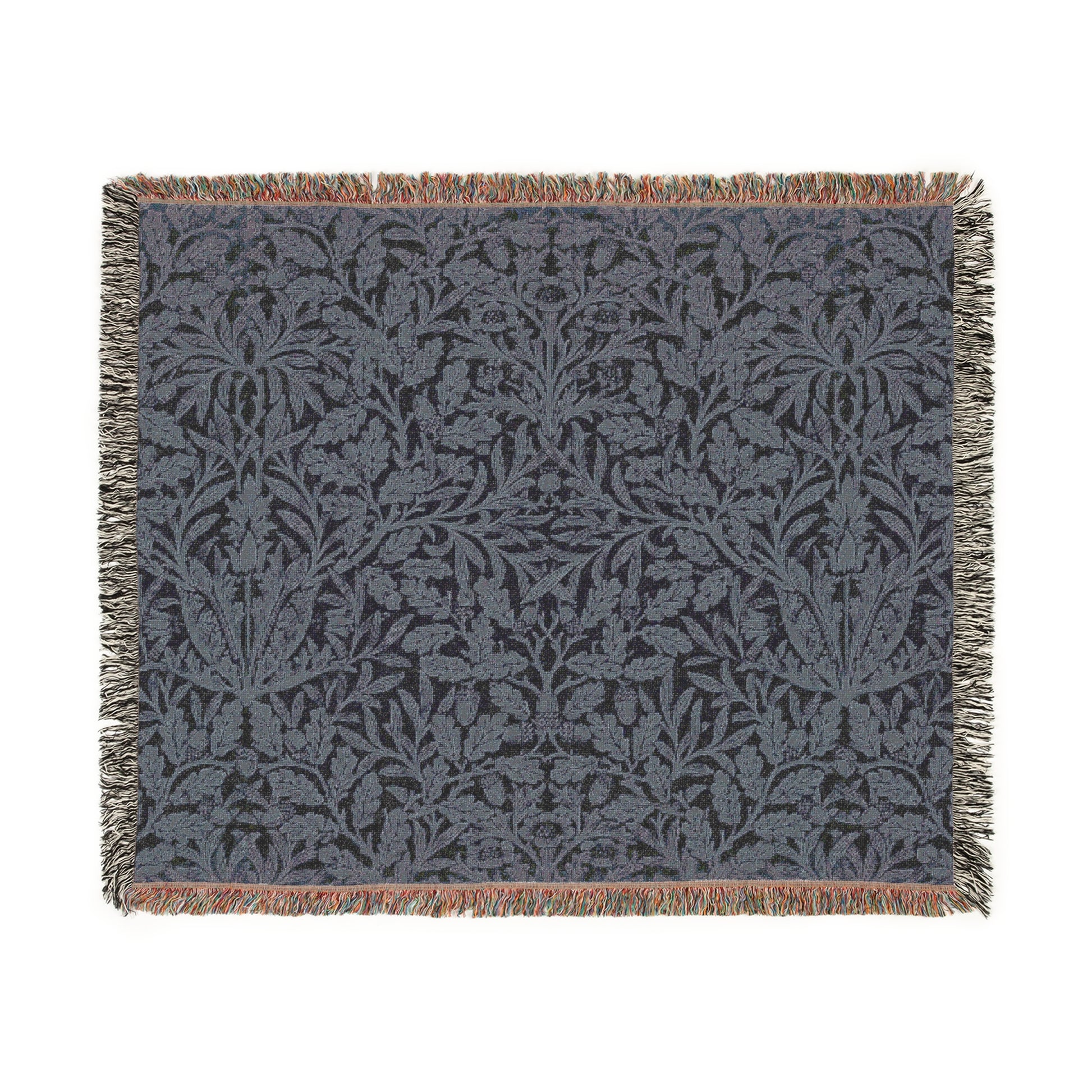 A woven cotton blanket with a geometric pattern in smoky blue color, featuring fringed edges.