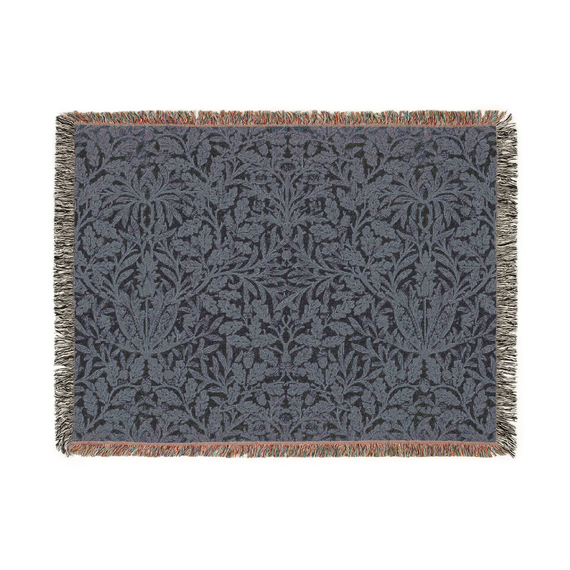 A woven cotton blanket with a geometric pattern in smoky blue color, featuring fringed edges.