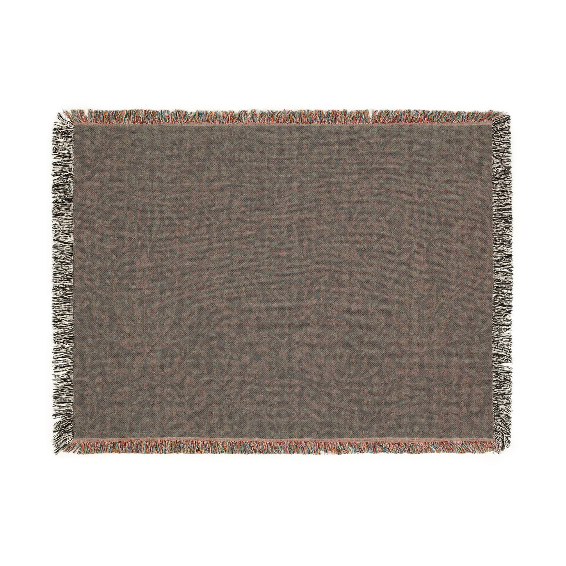 A woven cotton blanket with a geometric William Morris & Co pattern in smoky blue colour, featuring fringed edges.