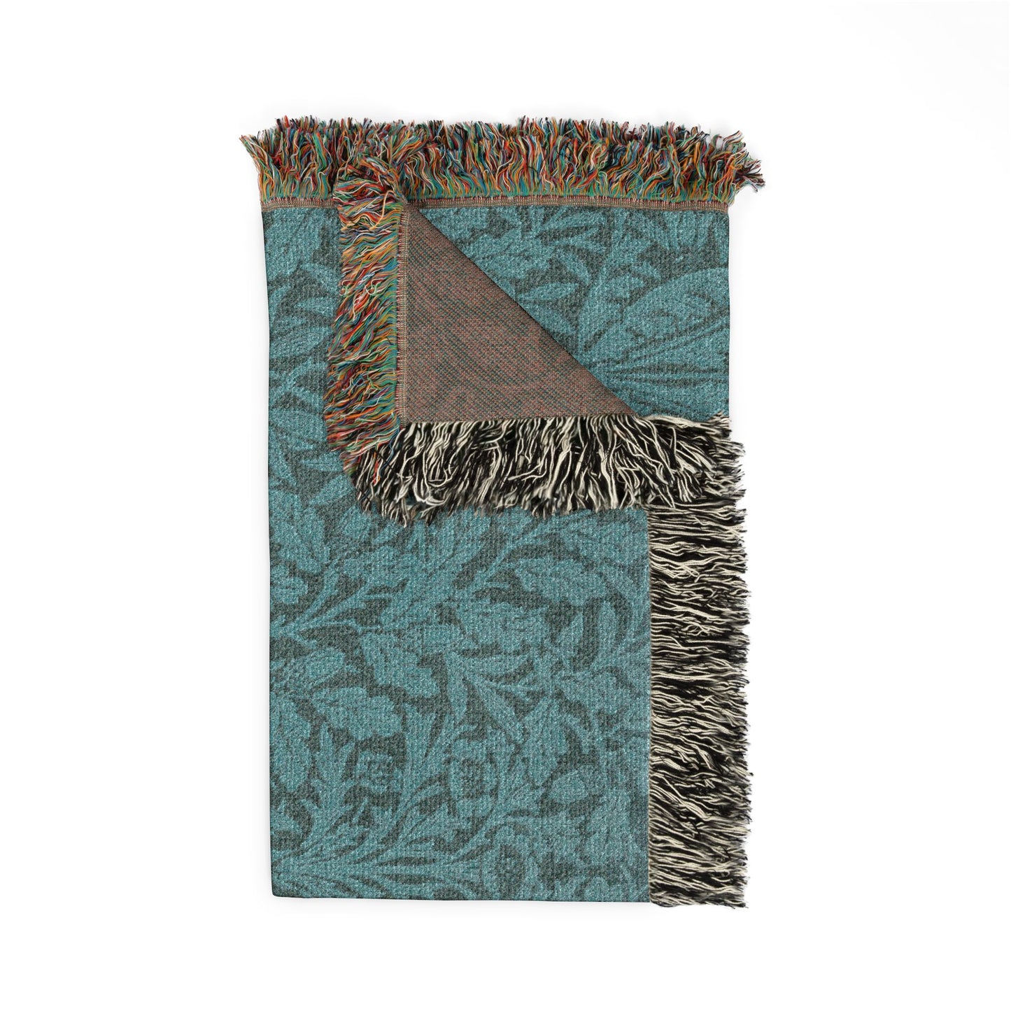 Patterned blanket with fringes on a white background