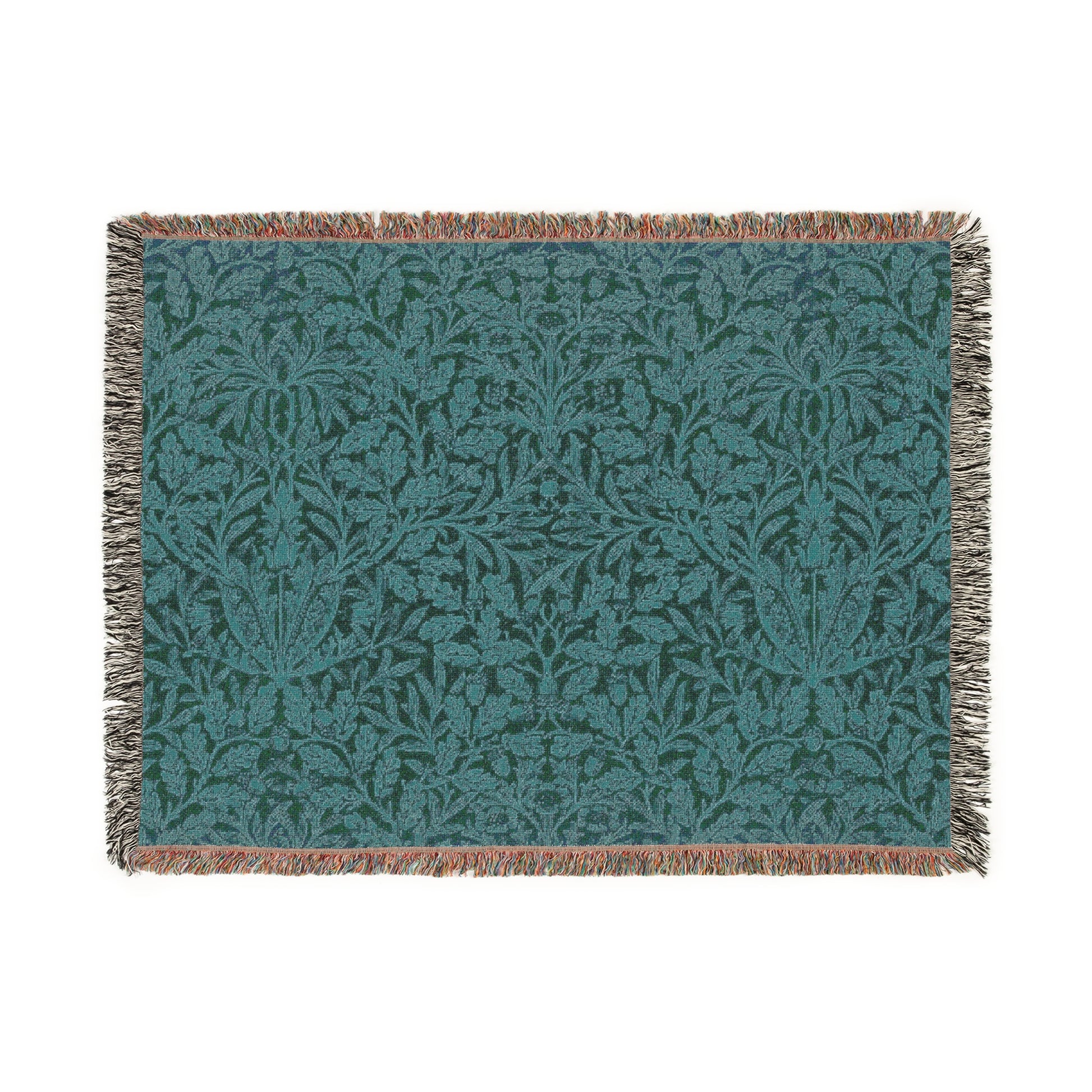 A woven cotton blanket with a geometric pattern in teal color, featuring a fringe.