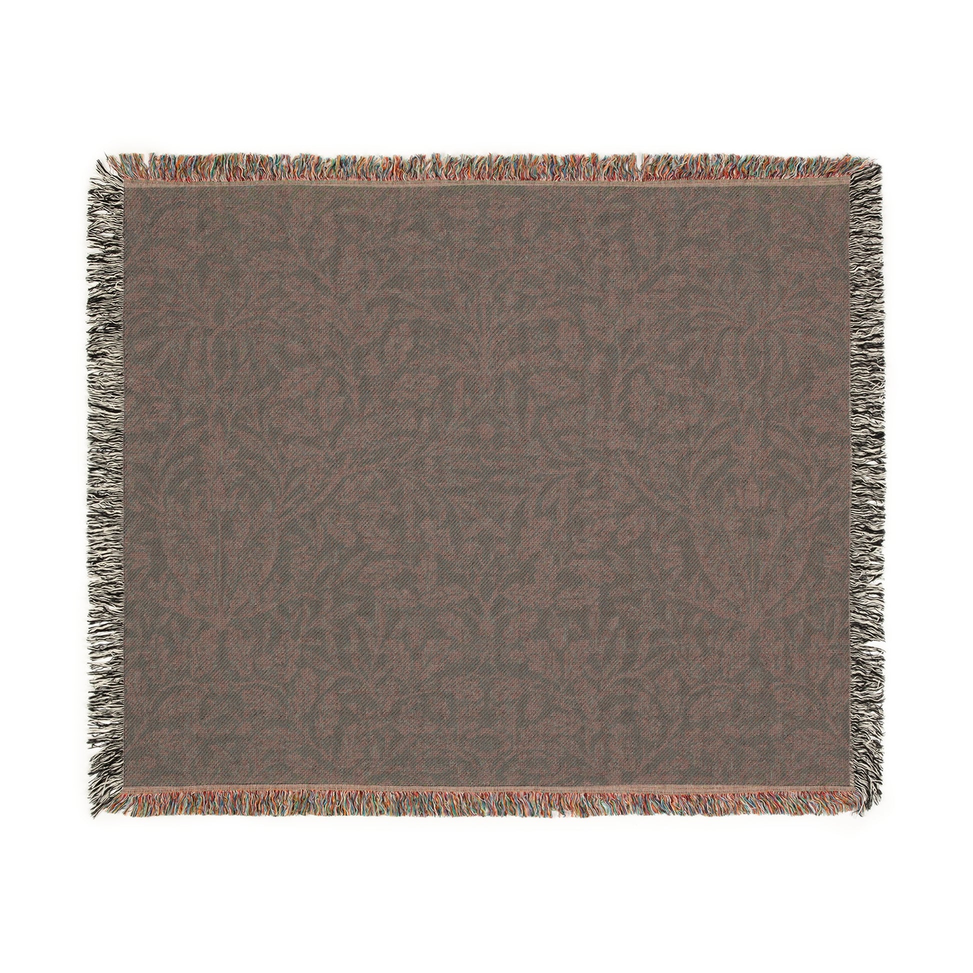 A woven cotton blanket with a William Morris & Co floral geometric pattern in teal colour, featuring a fringe.