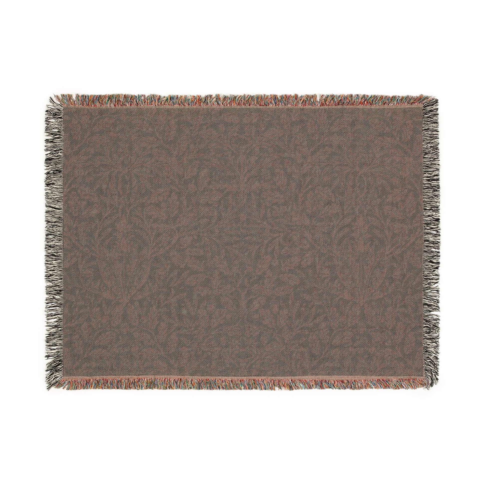 A woven cotton blanket with a William Morris & Co floral geometric pattern in teal colour, featuring a fringe.