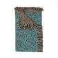 Teal and brown patterned blanket with fringed edges on a white background