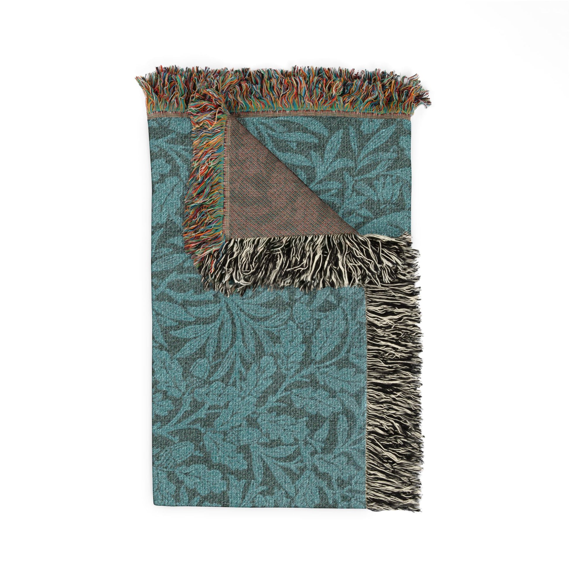 Teal and brown patterned blanket with fringed edges on a white background